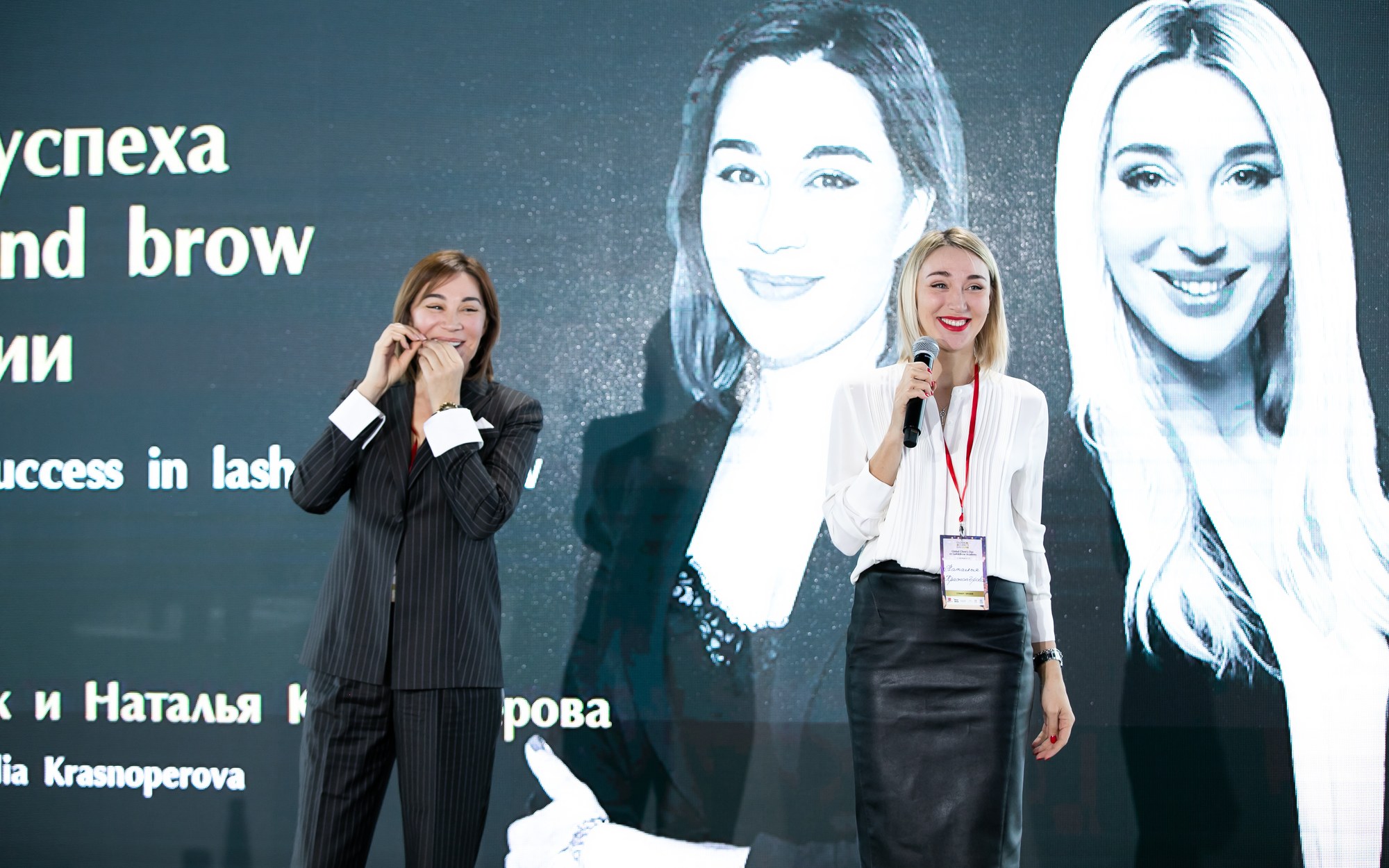 Irina Levchuk and Natalia Krasnoperova speaking together on stage at Global Clients Day